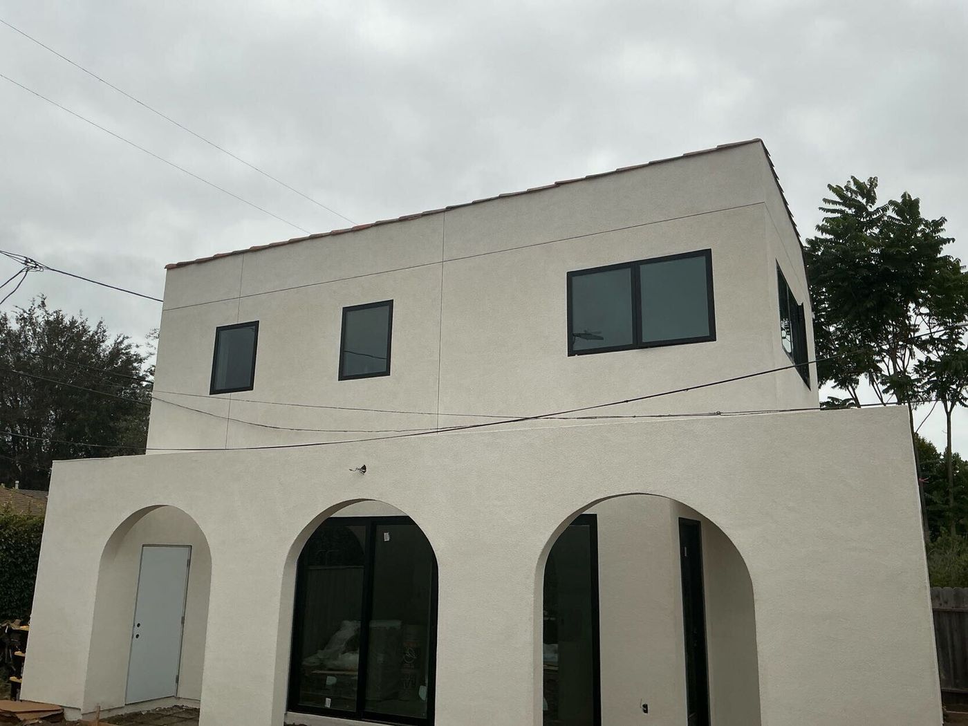Completed second-story addition, smooth stucco exterior